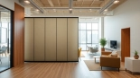 Experience a dynamic Folding Partition Wall seamlessly dividing spaces in a modern office environment.