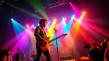 Independent artist captivating the crowd with an electric performance full of energy.