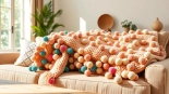 Cozy Moroccan Cotton Pompom Blankets elegantly styled on a sofa in a sunlit living room.