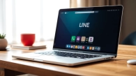 Download the LINE app for desktop with a vibrant interface shown on a laptop screen.