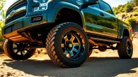Showcase of XD wheels on a rugged truck in an off-road setting with vibrant natural lighting.