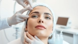 Facial balancing treatment enhancing facial features of a model in a bright clinic.