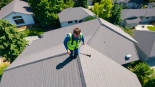 Detailing the process of Roof Replacement Vancouver Wa with a contractor inspecting work.