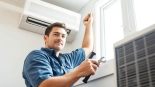 Expert conducting ac repair phoenix az on a residential unit, showcasing professional tools and natural light.