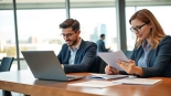 Apply for the uk eta online application with engaged professionals in a bright office setting.