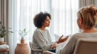 Engaging attachment theory specialist in a calming therapy room, promoting emotional healing.