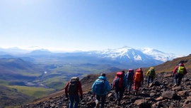 Experience adventure with Affordable Kilimanjaro Trekking Tours featuring trekkers conquering the slopes.