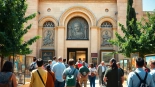 Visitors appreciating artworks at the Jerusalem Art Museum, featuring beautiful architectural details.