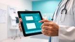 Engaging doctor using eprescribing software in a modern clinic, showcasing efficiency and professionalism.